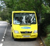 The minibus parked in a layby to pick up a passenger
